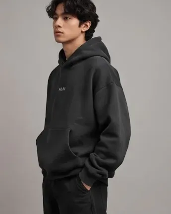 Streetwear komuter mengenakan DAE Essential Hoodie dengan tas selempang taktis di stasiun MRT Bundaran HI