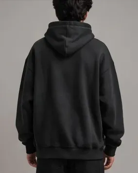 Model wearing charcoal hoodie rear back view